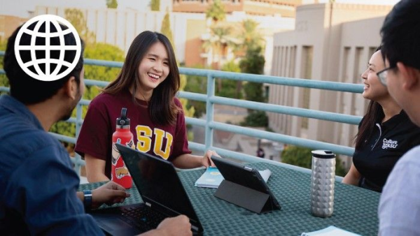 Group of students talking on a balcony on the Tempe campus