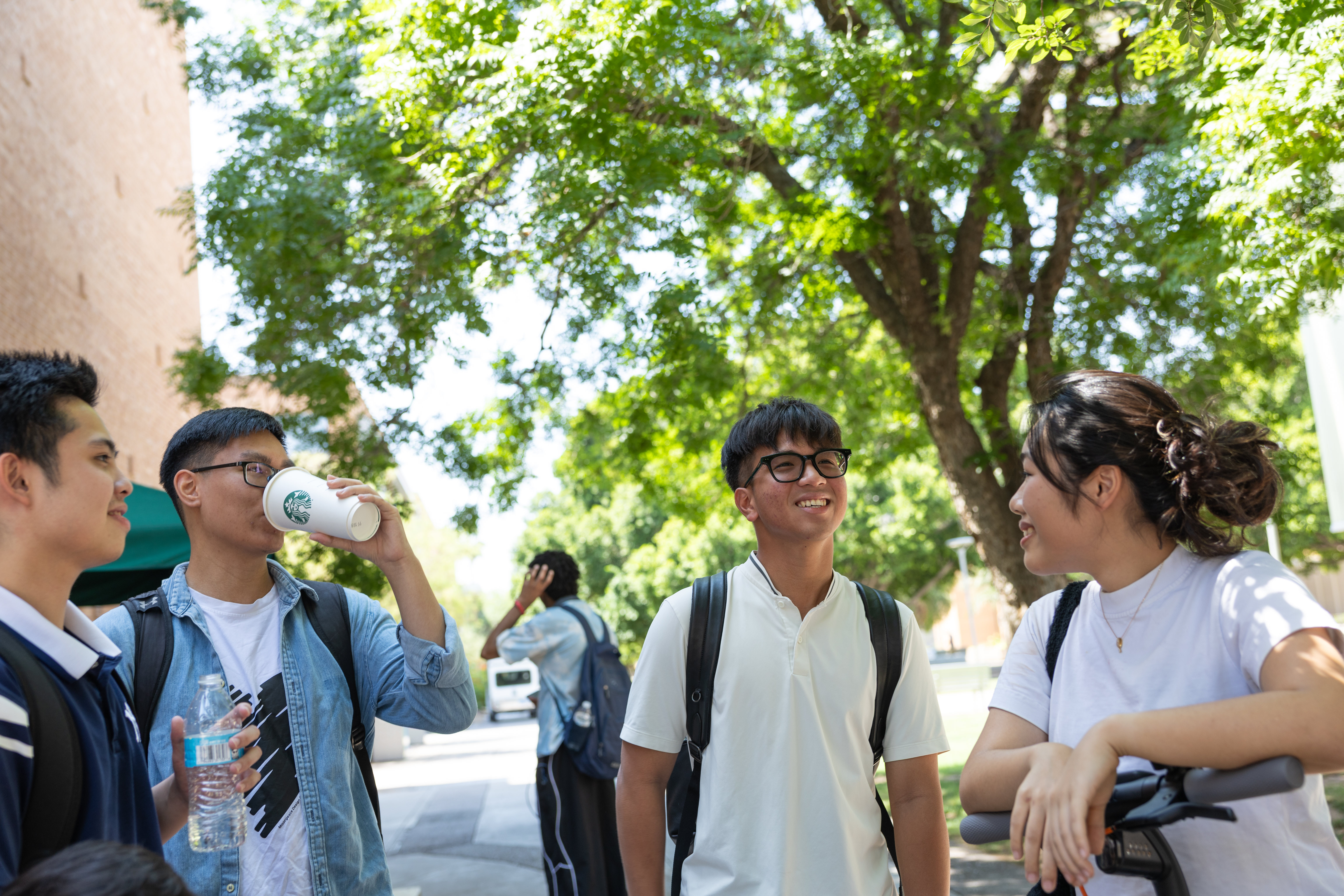 students laughing in front of the MU